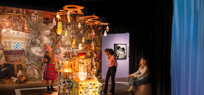 cult of beauty- people looking at the exhibition in the gallery